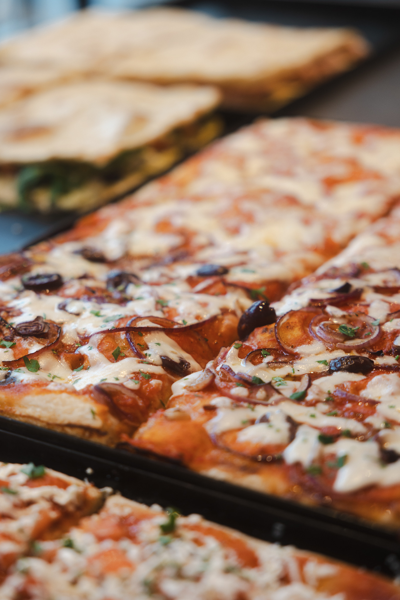 Fresh trays of colourful Pizzarama slices